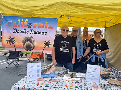 Four CDR team members at a booth.