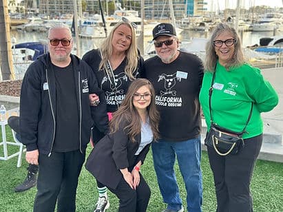 Group photo at marina event.